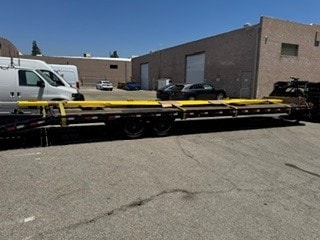Yellow equipment on flatbed