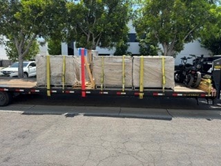 Flatbed with wooden cargo stakes
