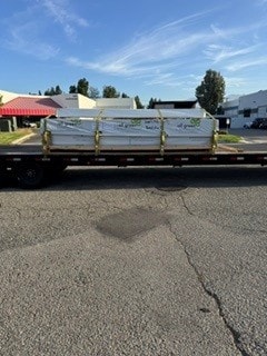 Flatbed loaded with white cargo