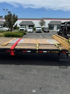 Flatbed trailer with red straps