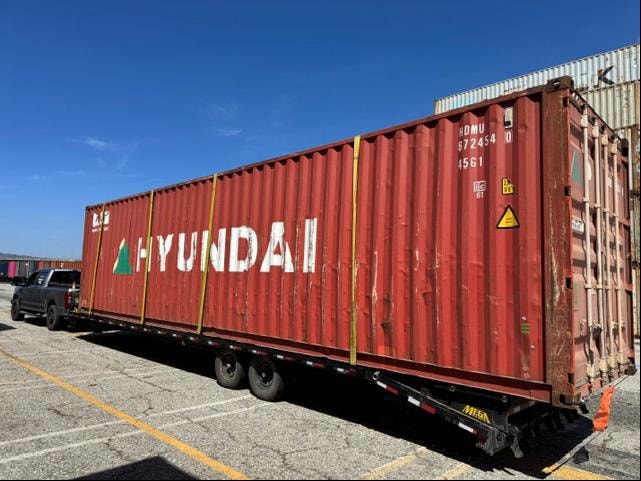 Hyundai shipping container on flatbed trailer